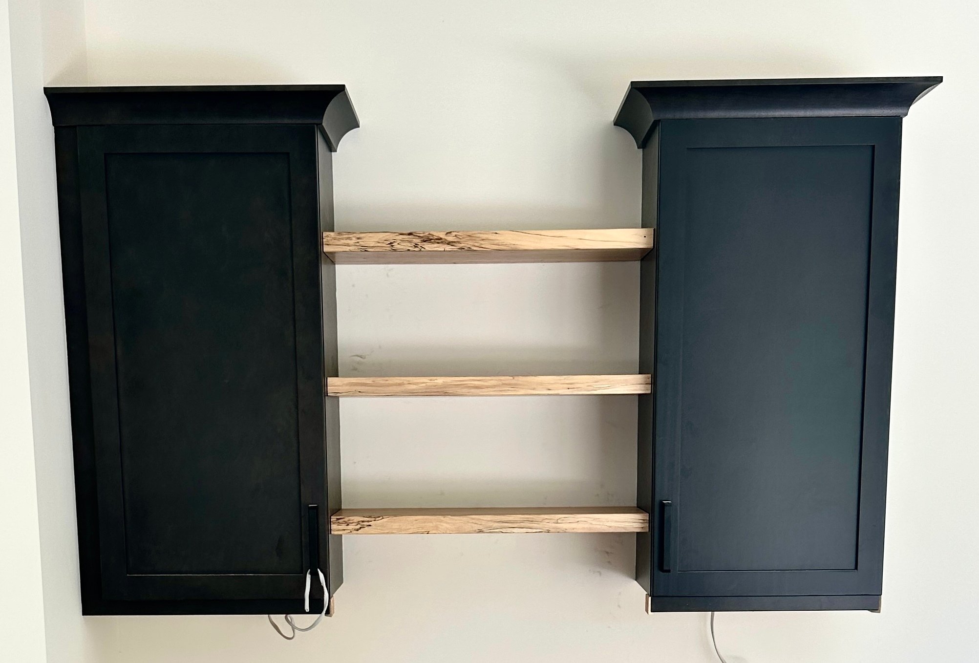 Spalted Maple Shelves Mounted Between Cabinets